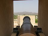 Muscat 06 Nizwa 08 Round Tower Cannon The Round Tower was designed for the new era of the cannon, with gun ports commanding a 360-degree field of fire. There are 24 openings all around the top of the tower for mortar fire.